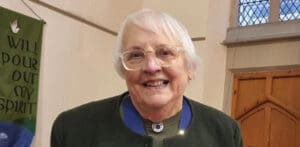 Elsie Leslie, older white woman, wearing glasses and smiling