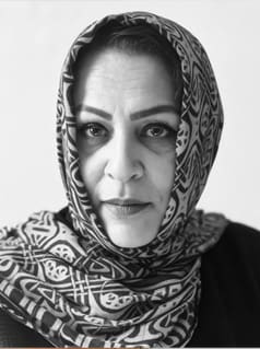 Woman wearing headscarf and looking at the camera